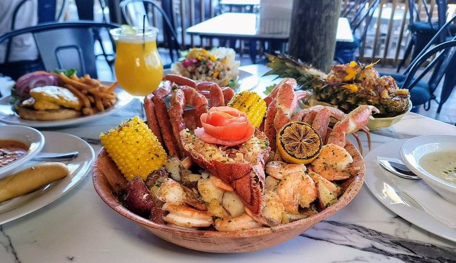 Group seafood feast platter as a restaurant hero backdrop